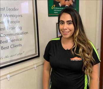 Female SERVPRO employee smiling at the camera